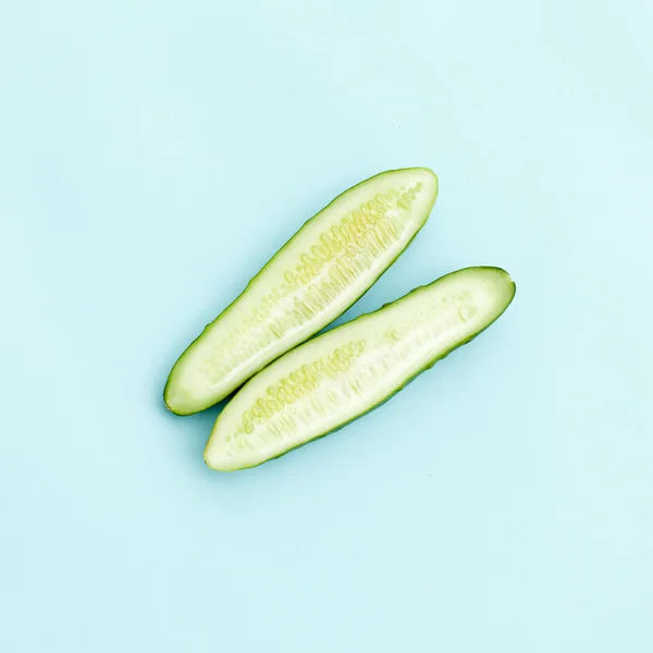 Isolated slice cucumber. Blue background Stock Photo