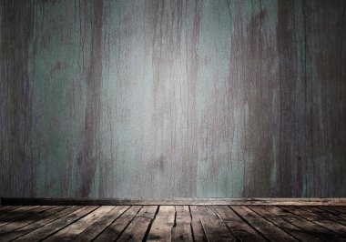 Mavi yeşil çimento grunge duvar ve spot ışığı ile ahşap vintage zemin