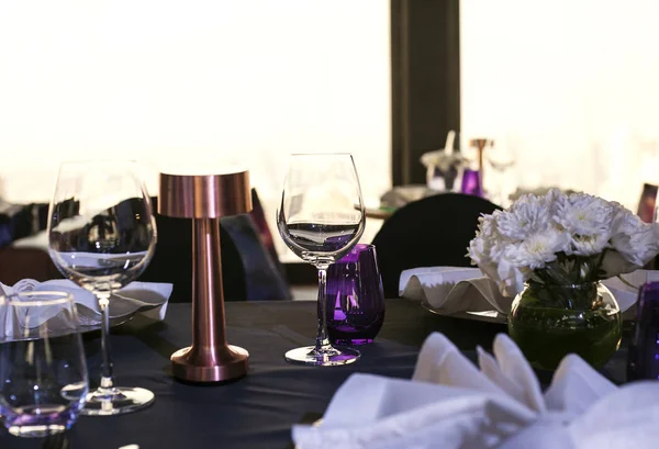 Table setup at dinner party, purple color theme