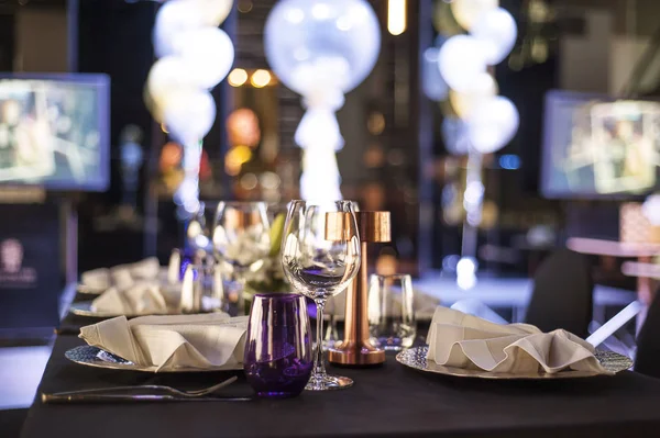 Table setup at dinner party, purple color theme