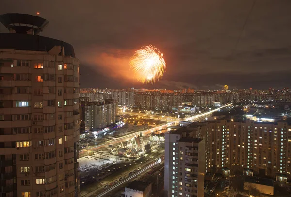 View of the night city with a salute in the sky. Moscow\'s densely populated area