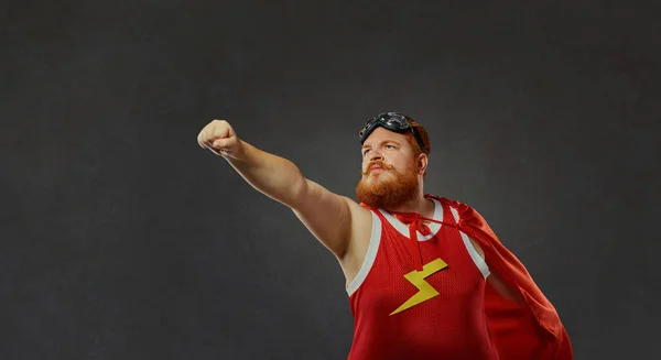 Fat funny man in a superhero costume. — Stock Photo, Image