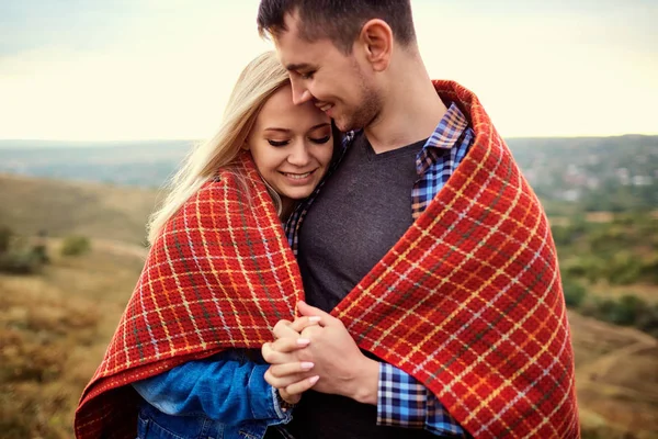 Happy couple under a plaid outdoors. — 스톡 사진