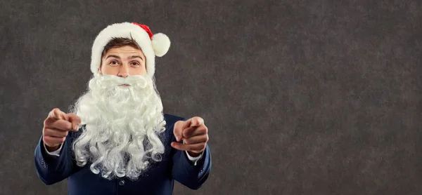 산타 클로스는 비즈니스에 맞게 포인트에 대 한 그의 손가락으로. — 스톡 사진