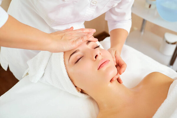 Beautiful woman at a facial massage.