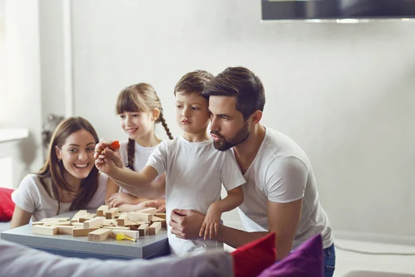 Happy family playing board games at home. — Stock Photo, Image