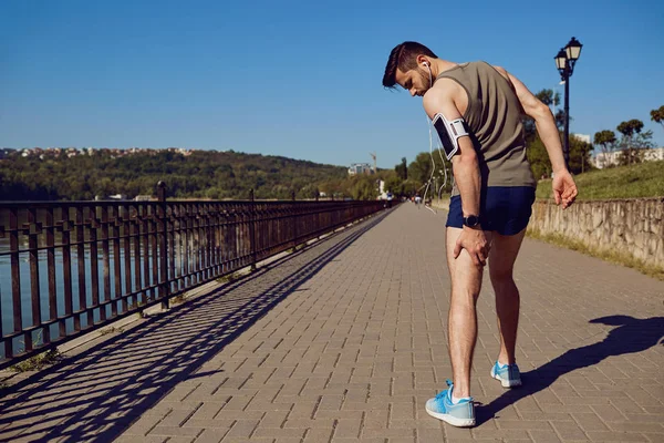 Injury, stretching, bruise on a run in a runner — Stock Image Injury, stretching, bruise on a run in a runner Stock Image