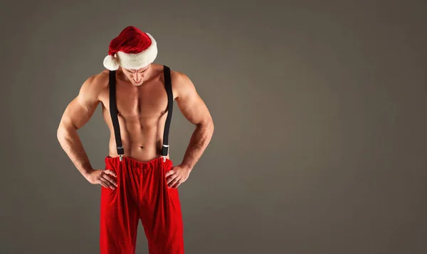 Santa with an athletic body. — Stock Photo, Image