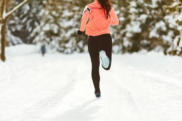 Closeup of girl runners feet in park in winter — Stock Photo, Image