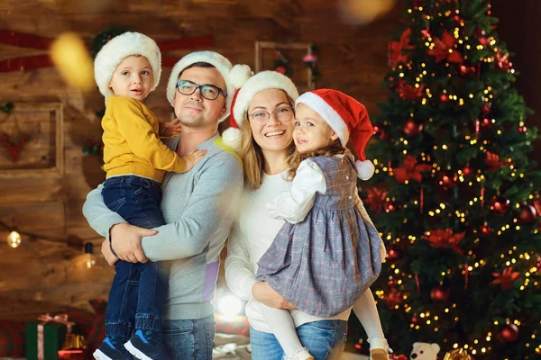 Happy family in the room at Christmas — ストック写真