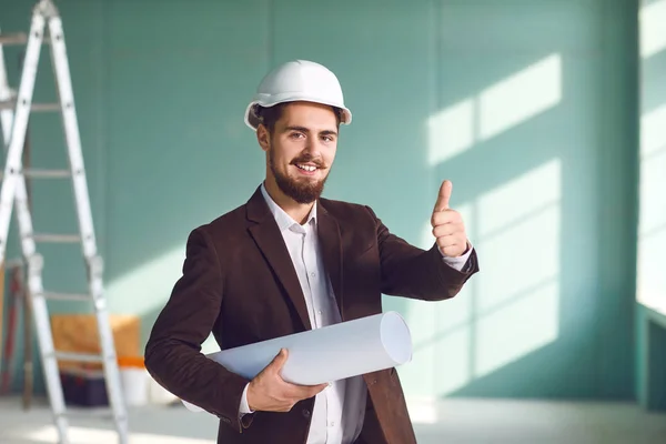 Foreman bearded man in a white helmet in a room at a construction site — Stock Photo, Image