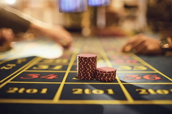 Roulette chips on a gaming table in a casino.