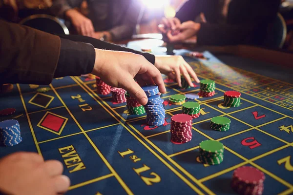 Roulette table chips in a casino. Gamblers make bets in a casino.