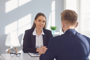 Recruitment of people. Applicant man at the interview in the office