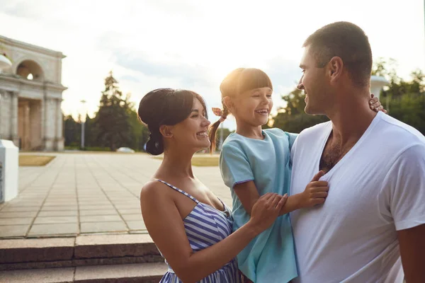 Happy smiling family hugging on the street. — 스톡 사진