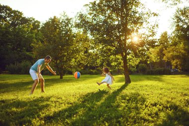 Fathers day. Father plays with his daughter in the summer park.