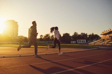 Running in the morning for health. Back view