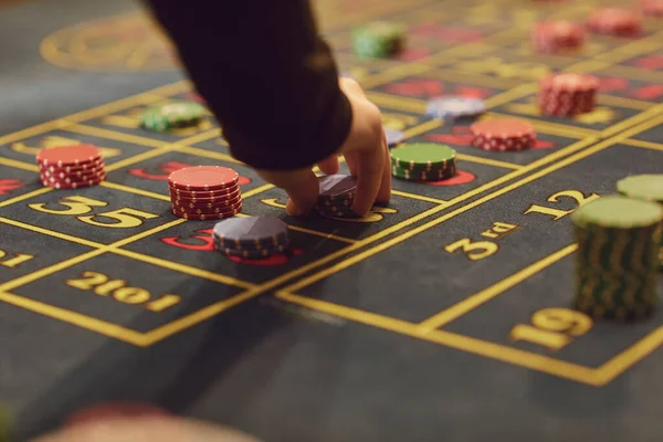 Roulette table chips in a casino. Gamblers make bets in a casino.