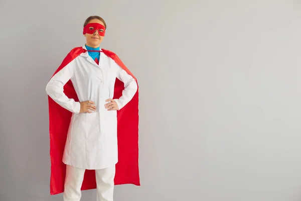 Doctor or nurse superhero on a gray background. — Stock Photo, Image