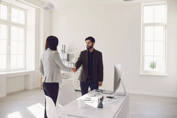 Smiling formal man and woman meeting in office — Stok fotoğraf