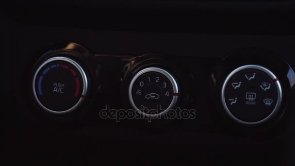 Mans hand push the button that switches the air conditioning in the car. — Stock Video