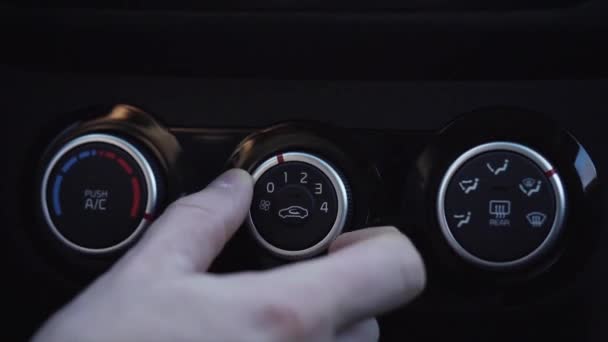 Close up shot mans hand turn on the air conditioning system in the machine. — Stock Video