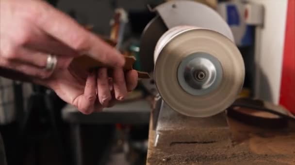 The master who works with skin frames the edge of the detail in electric machine — Stock Video