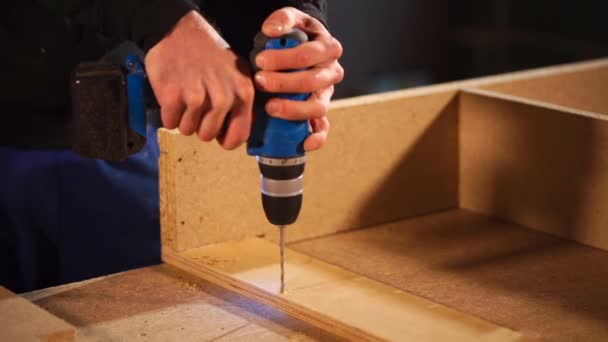 Drilling holes at the bottom of board — Stock Video