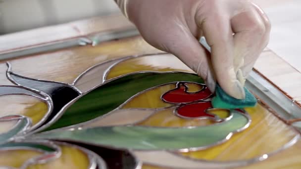 Worker is cleaning and polishing a stained-glass after finish of works — Stock Video