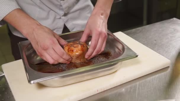 Talented chef is turning a fish billet in a delicious sauce and spices — Stock Video