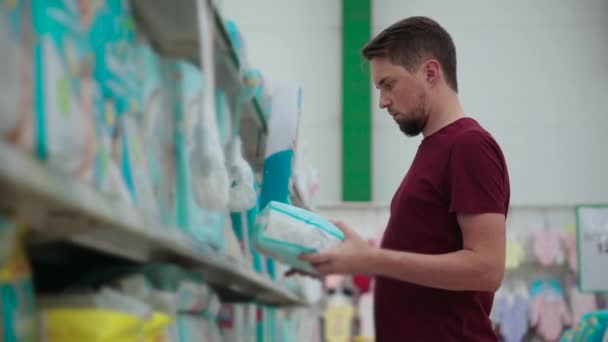 Man buying diapers — 비디오