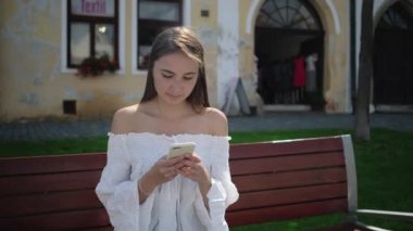 Young brunette chatting on mobile