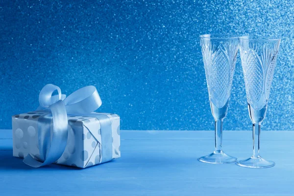 stock image on a blue table is a box in a gift box, gift, surprise, New Years present,