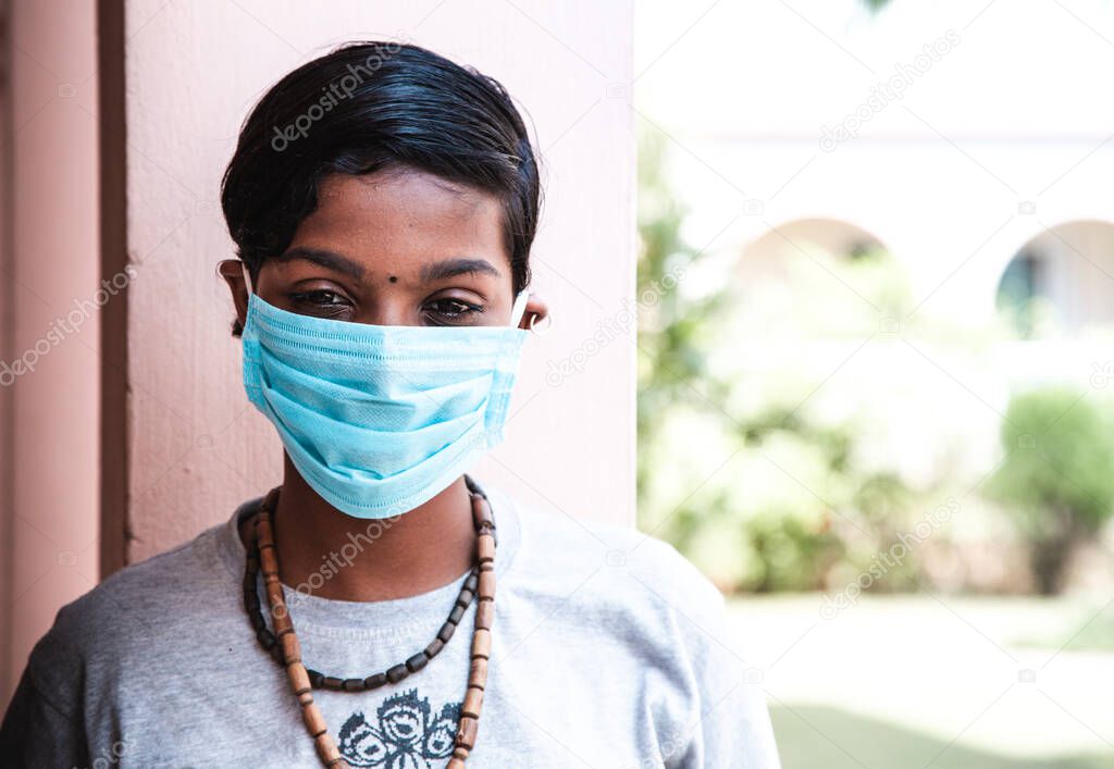 coronavirus. Portrait of beautiful young dark-skinned teenager girl wearing protective medical face mask. concept of Corona virus quarantine, Covid-19. african adult girl illness prevention. mers cov