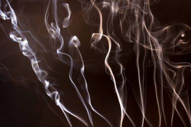 Siyah bir arka plan üzerinde duman. Hareket desenler arka plan grafik duman.