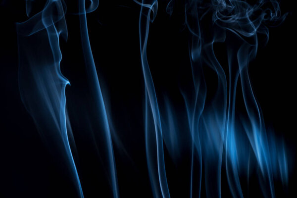 Smoke on a black background. Smoke movement patterns of background graphics.