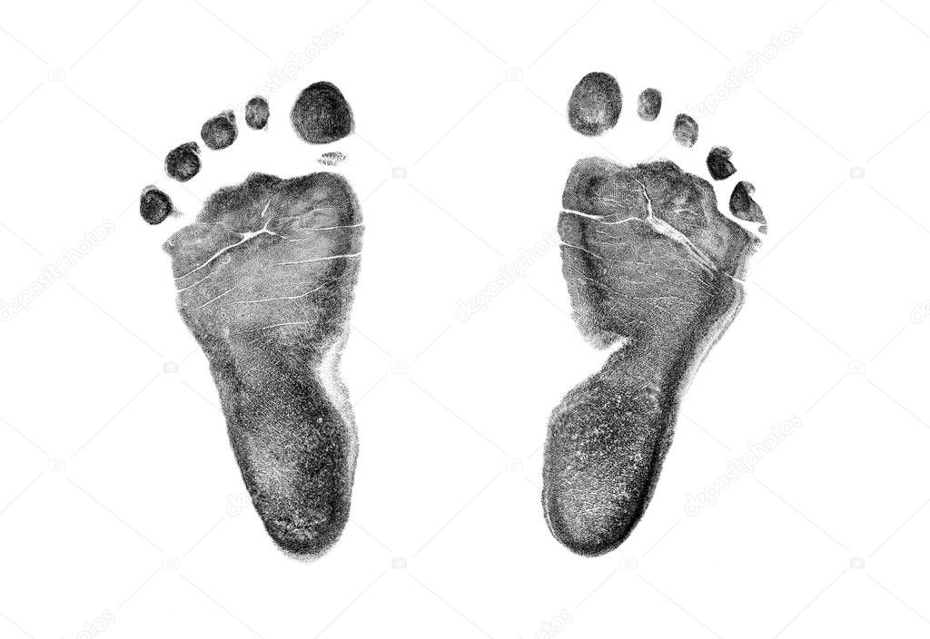 Real baby footprint on transparent paper isolated on white background.