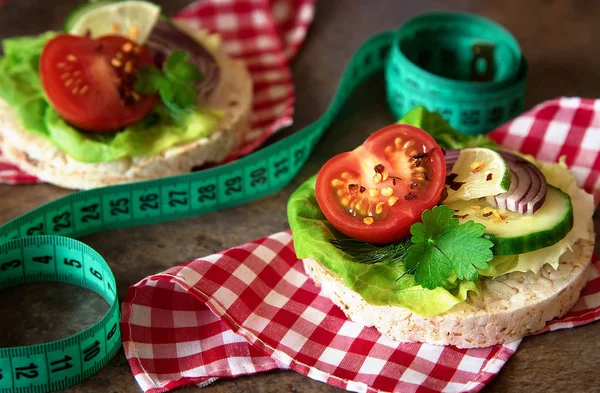 Healthy food - sandwiches, rice cakes with lettuce, tomato, cucu