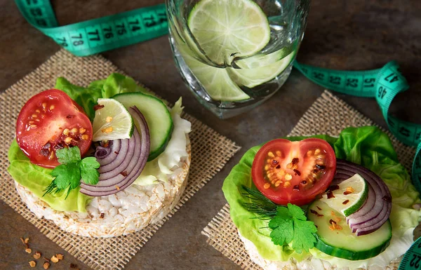 Healthy food - sandwiches, rice cakes with lettuce, tomato, cucu