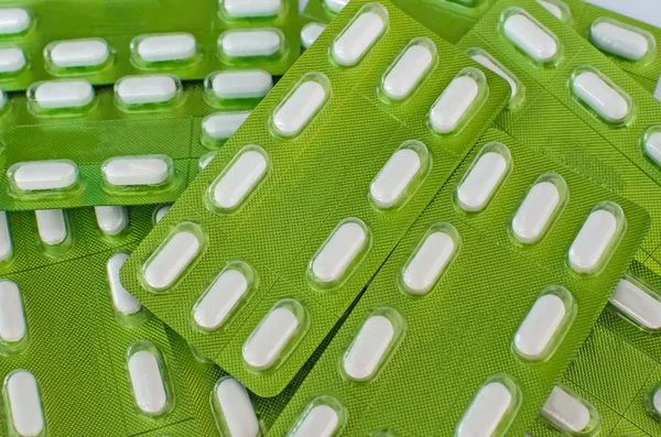 white tablets in green blister