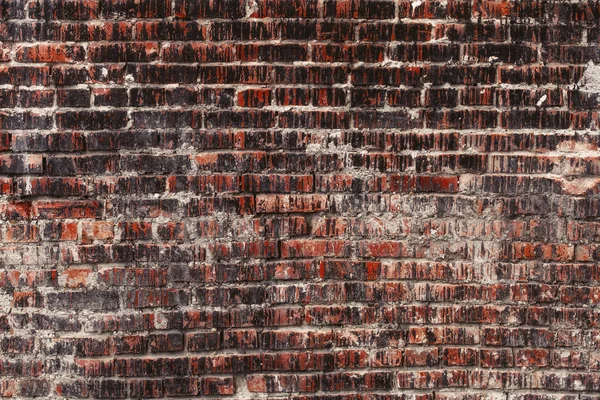 Старая стена из темного кирпича, на фоне гранжа — стоковое фото