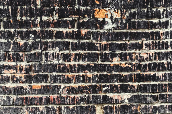Старая стена из темного кирпича, на фоне гранжа — стоковое фото