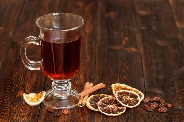 Compote or tea with fruit ingridients, dried orange, cinnamon, raisin — Stock Photo, Image