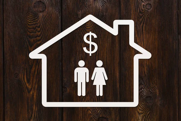 Casa de papel com homem, mulher e dólar sinal dentro — Fotografia de Stock