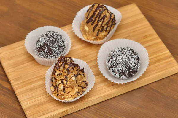 Candies with coconut and chocolate topping — Stock Photo, Image