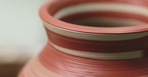 Red Painted Pot Rotating Pottery Wheel Just Painted Brush Closeup — Stockvideo