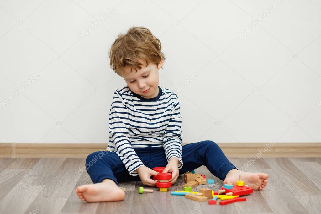 Child boy sitting and playing. Stay home concept, Coronavirus Covid-19 quarantine