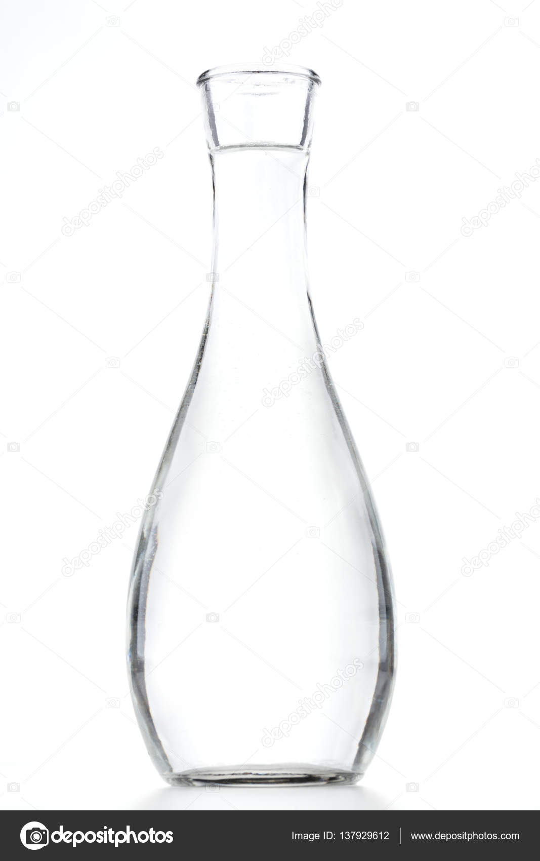 Short stem wine glass half full of water on a white background with a  reflection Stock Photo