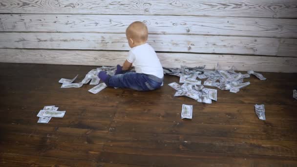 Child and a lot of money on the floor hd — Stock Video