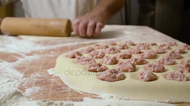 Roll out a dough sheet — Stock Video